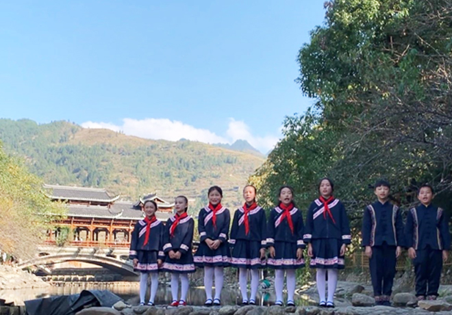 Donation of Miao ethnic school uniforms to four primary schools in Leishan County